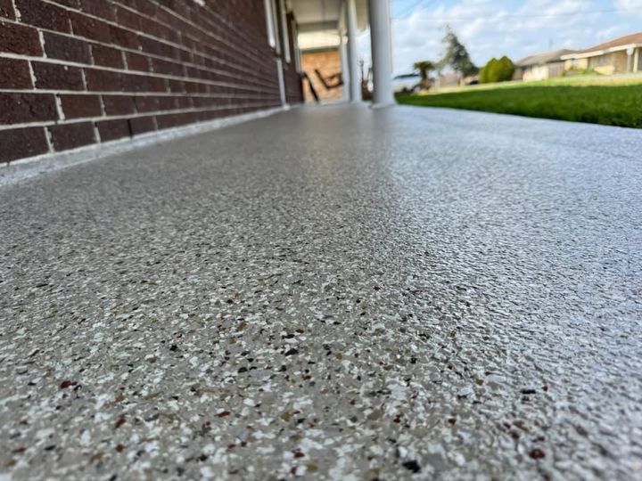 Close-up of a full-flake epoxy floor with gray, black and white chips