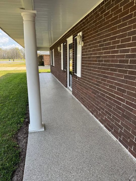 Covered porch walkway with a gray flake epoxy floor