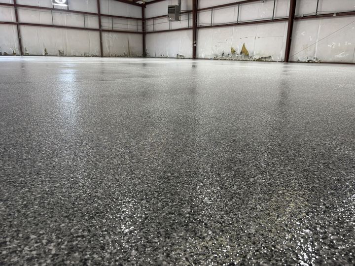 Warehouse floor with a gray full-flake epoxy coating