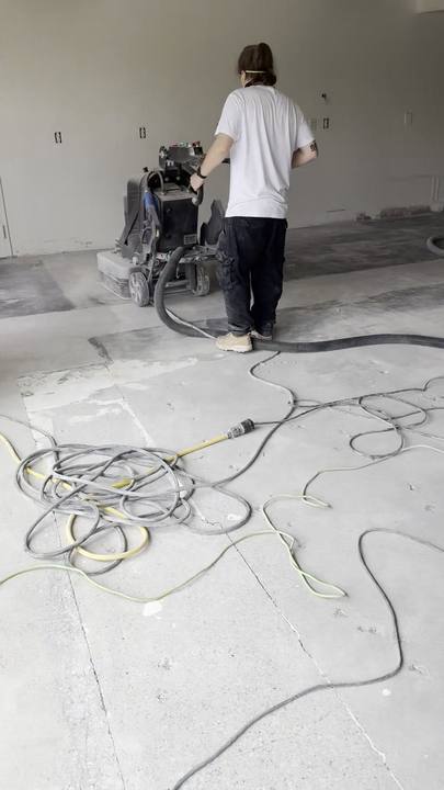 Diamond grinding a concrete floor with a planetary grinder
